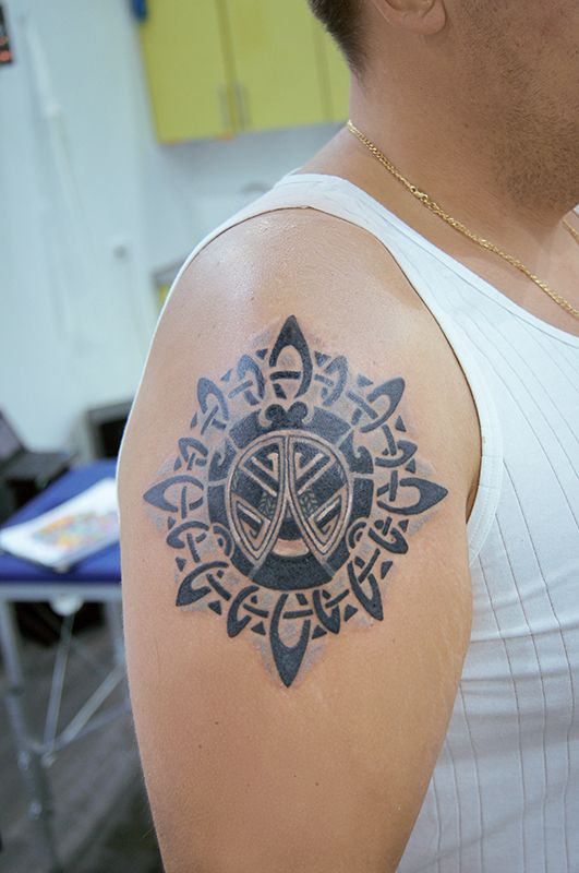 Татуировка солярный символ