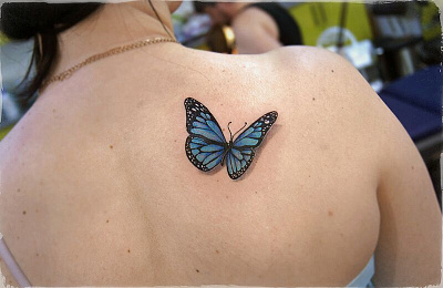 Татуировка бабочка на спине