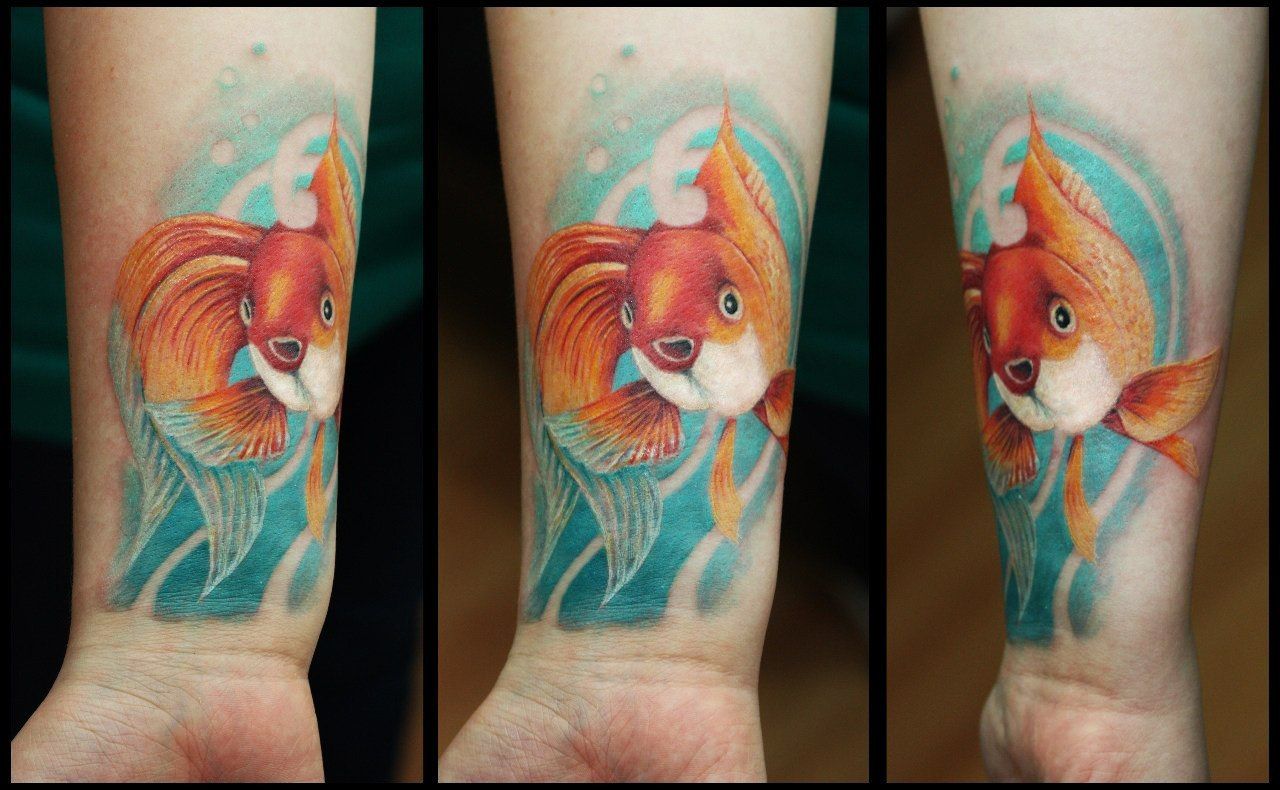 татуировка золотая рыбка