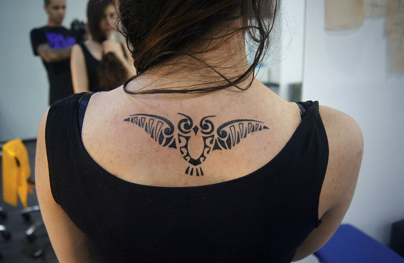 Татуировка сова на спине